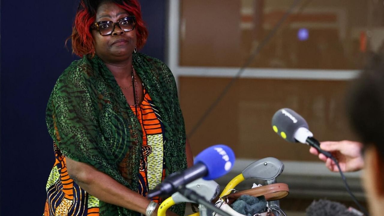 Huguette, one of the French nationals and other European citizens, who have been evacuated from Niger, days after a junta seized power in the West African country, speaks to media. Credit: Reuters Photo