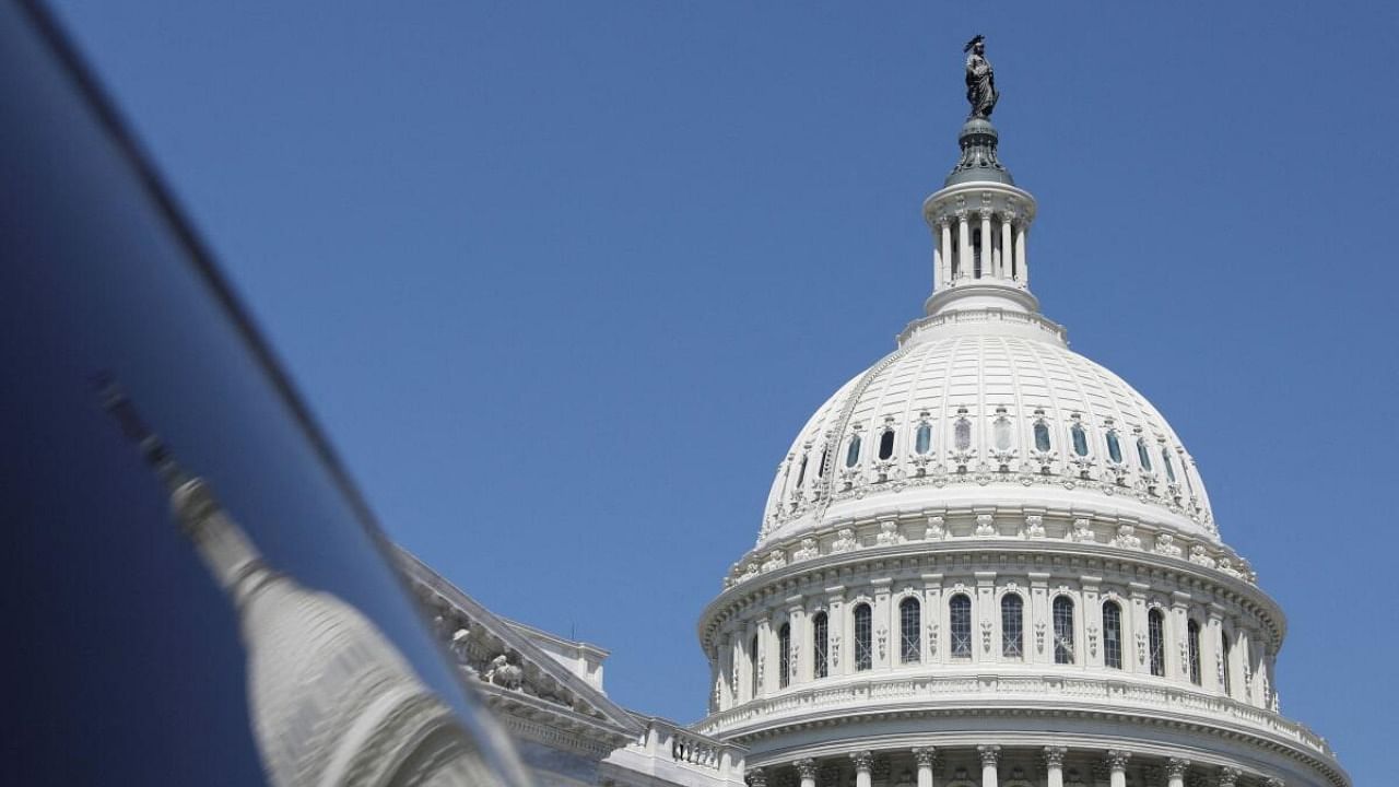 <div class="paragraphs"><p>The dome of the US Capitol is reflected in a window on Capitol Hill in Washington, US, April 20, 2023. </p></div>