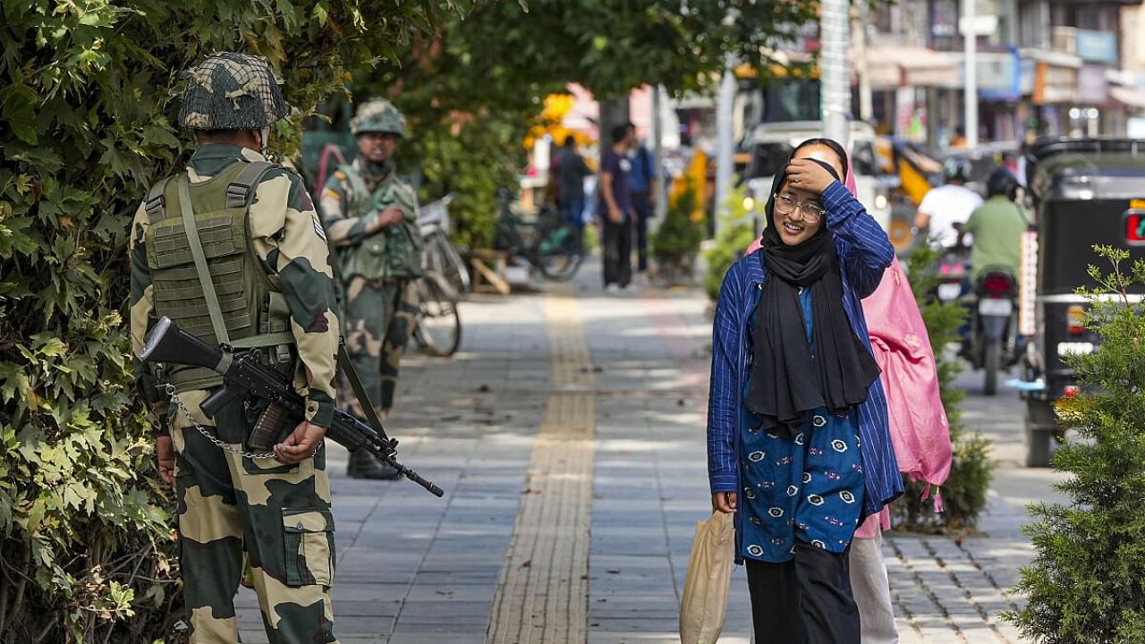 BSF personnel stand guard on a street, a day before the fourth anniversary of the abrogation of Article 370 of the Constitution, in Srinagar, Friday, Aug. 4, 2023. Credit: PTI Photo