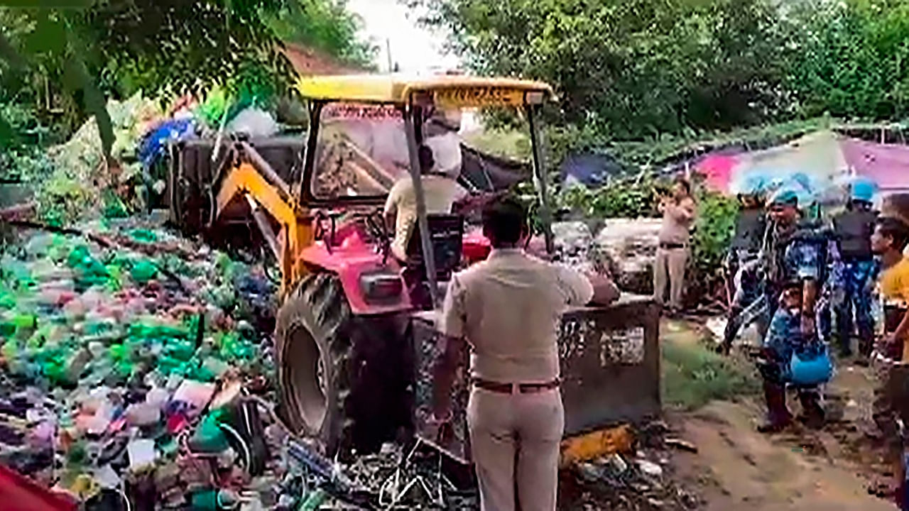 Police use heavy machinery to demolish shanties in Tauru near violence-hit Nuh. Credit: PTI Photo