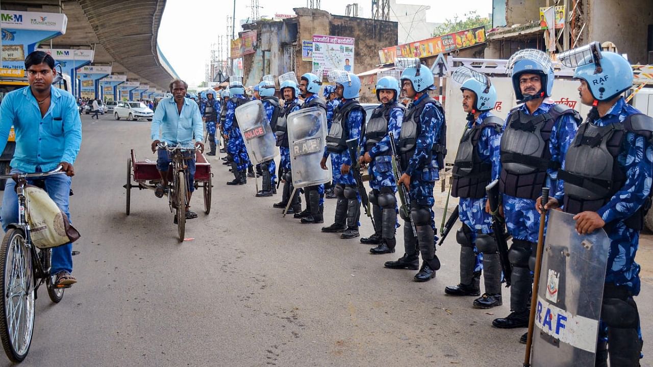 Rapid Action Force (RAF) personnel deployed at Badshahpur after incidents of violence following Monday's attack on a VHP procession in adjoining Nuh district, in Gurugram, Thursday, Aug. 3, 2023. Credit: PTI Photo