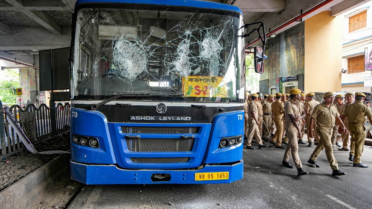 A damaged public bus is seen after a clash between police personnel and locals following a road accident in which a student of Barisha High School was killed by a speeding truck, in Kolkata, Friday, Aug. 4, 2023. Credit: PTI Photo