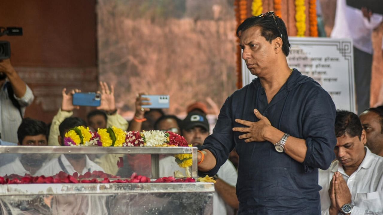 Film director Madhur Bhandarkar pays his last respects to deceased film art director Nitin Desai at ND Studio, in Karjat, Friday, Aug. 4, 2023.  Credit: PTI Photo