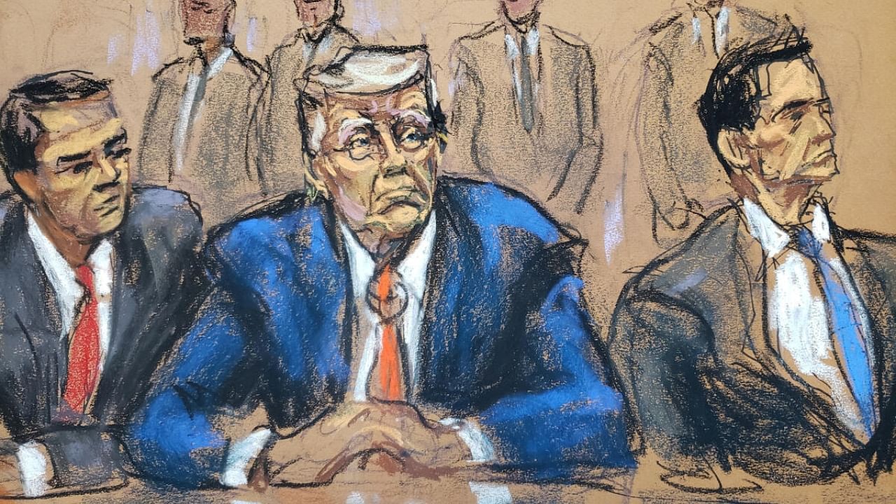 Former US President Donald Trump sits between his attorneys Todd Blanche and John Lauro as he faces charges before Magistrate Judge Moxila A. Upadhyaya that he orchestrated a plot to try to overturn his 2020 election loss, at federal court in Washington, US, August 3, 2023 in a courtroom sketch. Credit: Reuters Photo