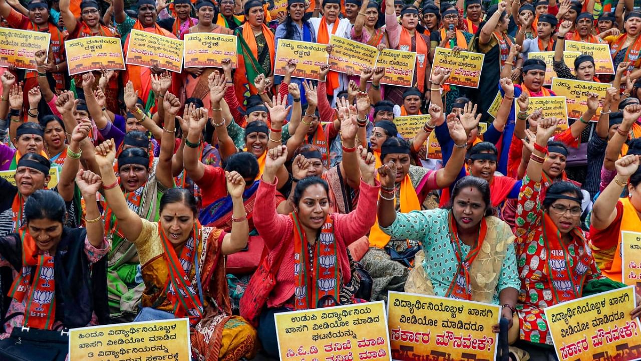 BJP Mahila Morcha workers protest against the state government demanding immediate action against three girl students booked over allegedly recording a video of their fellow female student in the washroom of a paramedical college in Udupi. Credit: PTI File Photo