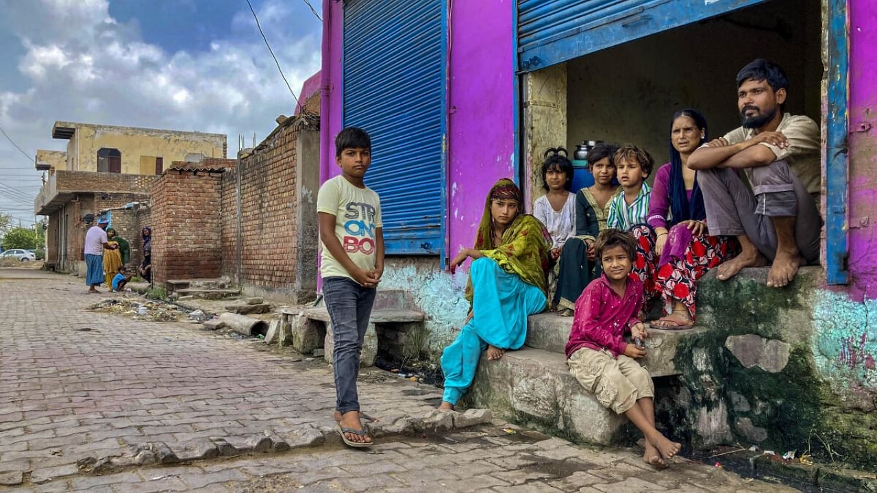 <div class="paragraphs"><p>Locals at a deserted area in Nuh district.</p></div>