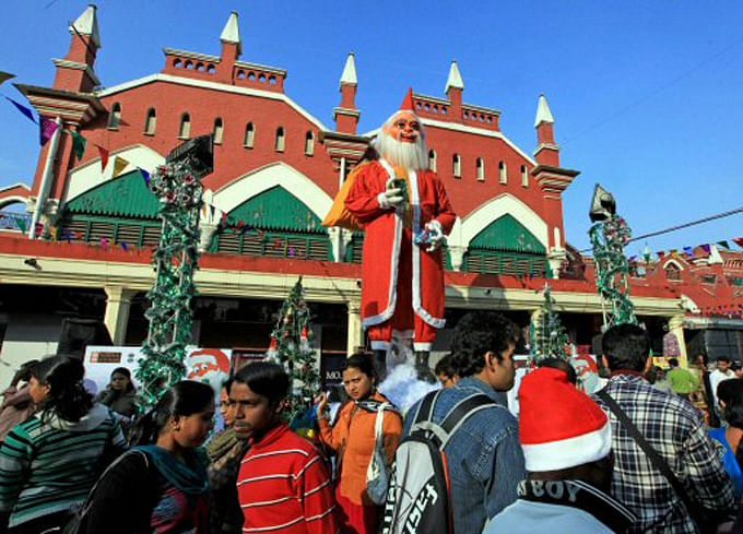 People participate in a street carnival during Christmas festivities in Kolkata on Friday.