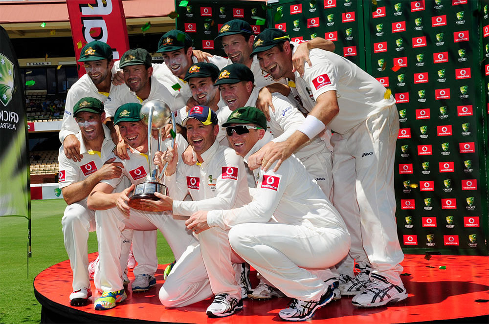 Australia's cricket players celebrate victory over India after the  cricket test match against India in Adelaide, Australia, Saturday, Jan.  28, 2012. AP Photo