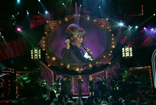 In this photo provided by the Las Vegas News Bureau, Whitney Houston performs during the Billboard Awards at the MGM Grand in Las Vegas on Dec. 7, 1998. Often referred to as the Queen of Pop music at her best, Houston ex-wife of singer Bobby Brown, d...