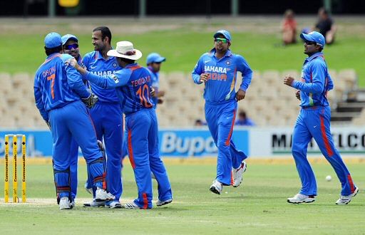 India's players celebrate the dismissal of Sri Lanka's Tillakaratne Dilshan, unseen, during their One Day International cricket series match in Adelaide, Australia, Tuesday, Feb. 14, 2012. AP Photo
