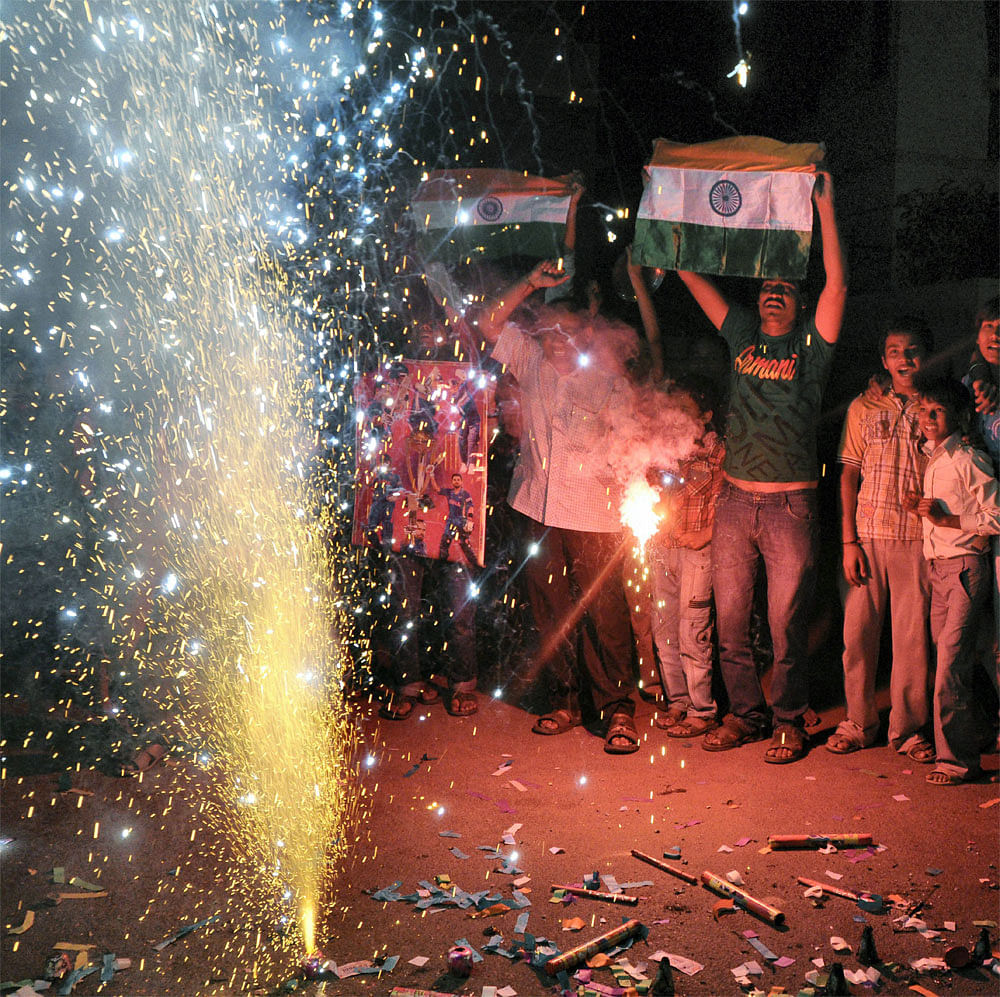 Cricket fans celebrate India's victory over Pakistan in the Asia Cup, in Ahemdabad on Sunday. PTI Photo