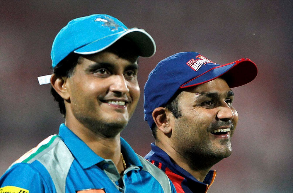 Delhi Daredevils' Virender Sehwag and Pune Warriors' Sourav Ganguly after their IPL-5 match in New Delhi on Saturday. PTI Photo