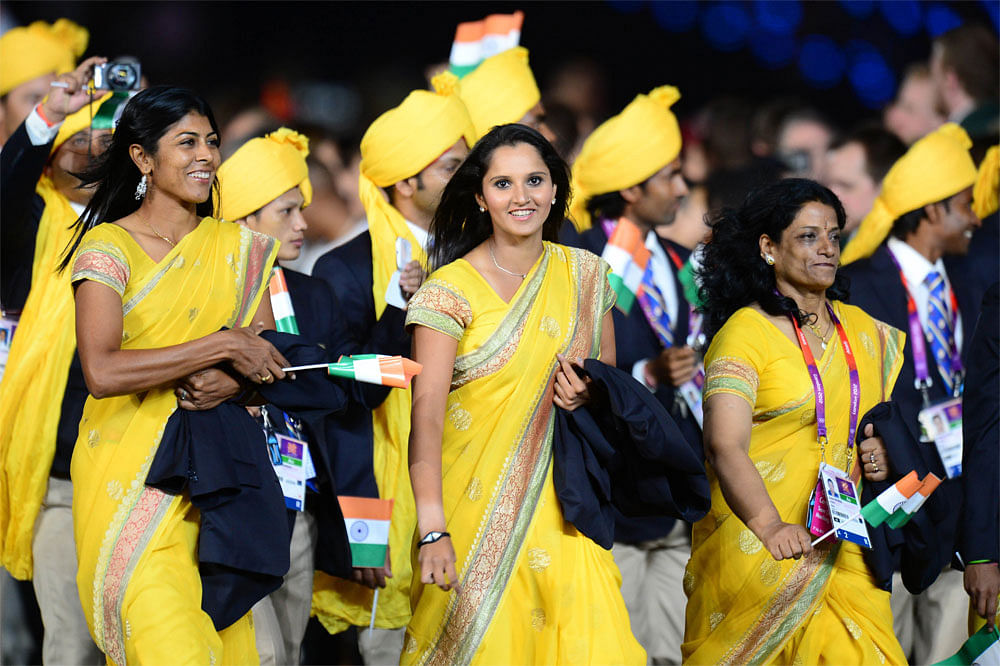 Members of India's delegation parade in the opening ceremony of the  London 2012 Olympic Games in the Olympic Stadium in London on July 27,  2012.   AFP