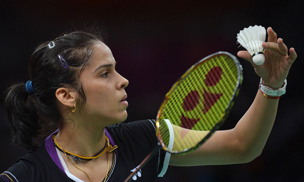 India's Saina Nehwal plays a shot to Lianne Tan of Belgium during their womens singles badminton match at the London 2012 Olympic Games in London on July 30, 2012. Nehwal won 21-4, 21-14. AFP
