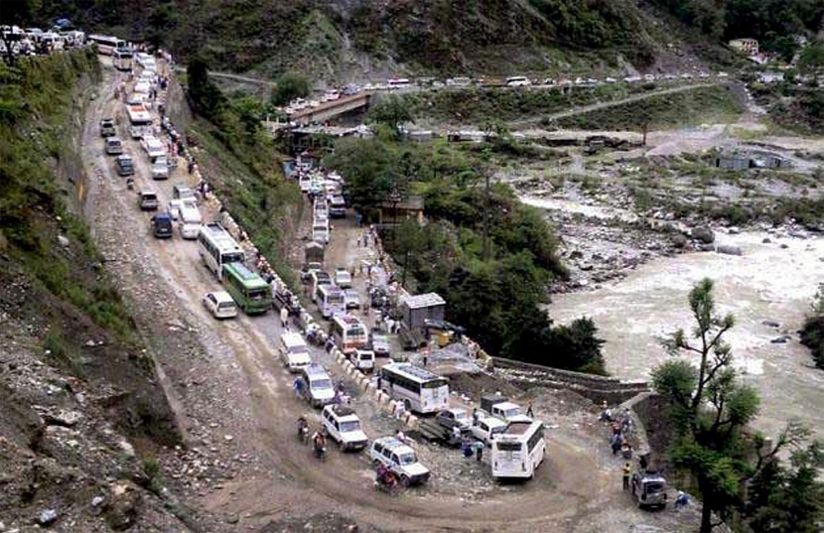 Vehicles stranded in mud on a highway after cloud burst and heavy rains in Uttarkashi on Monday. PTI Photo