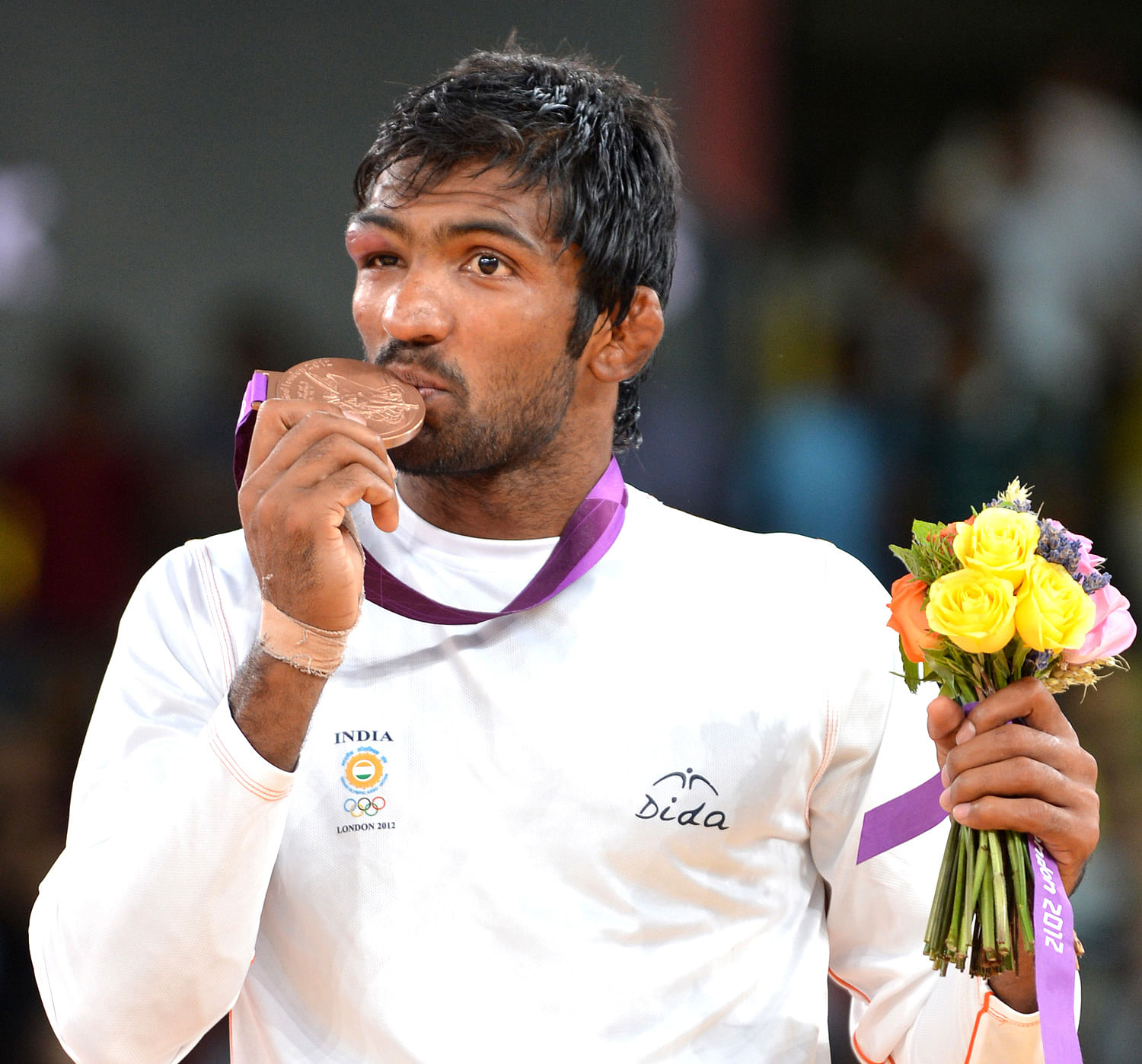 India's Yogeshwar Dutt with Bronze medal during the medal ceremony of Men's 60kg Freestyle wrestling at the Olympic Games in London on Saturday. DH Photo/ KN Shanth Kumar