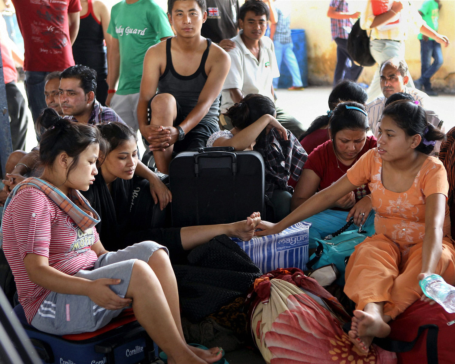 People from North Eastern states wait to board a train at Chennai Central railway station on Friday to return to their homes after rumours of attacks. PTI 