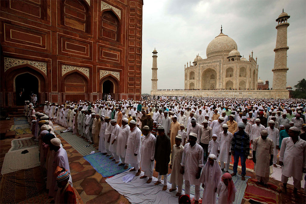 Muslims offer Eid al-Fitr prayer at the famous Taj Mahal in Agra, India, Monday, Aug. 20, 2012. Muslims around the world celebrate Eid al-Fitr, marking the end of the holy month of Ramadan. AP Photo