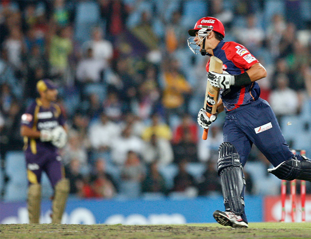 Delhi Daredevils's batsman Ross Taylor reacts after his dismissal by Kolkata Knight Riders's bowler Pradeep Sangwan, unseen, for 35 runs during the Champions League Twenty20 cricket match at the Centurion Park in Pretoria, South Africa, Saturday, Oct...