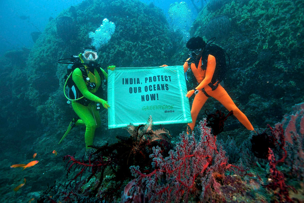 Andaman and Nicobar : Greenpeace activists unfurl a banner reading 'India, Protect our Oceans now' under ocean water in Andaman and Nicobar on the eve of the high level segment meetings at the UN conference on biodiversity COP11 in Hyderabad on Wedne...