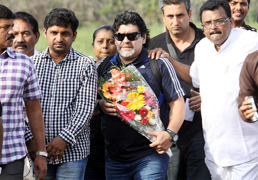 Argentina soccer legend Diego Maradona, center, arrives in Kannur, Kerala, India, Tuesday, Oct. 23, 2012. Maradona Tuesday arrived in India’s southern most state to inaugurate a jewelry showroom and launch the operations of a new private airline se...