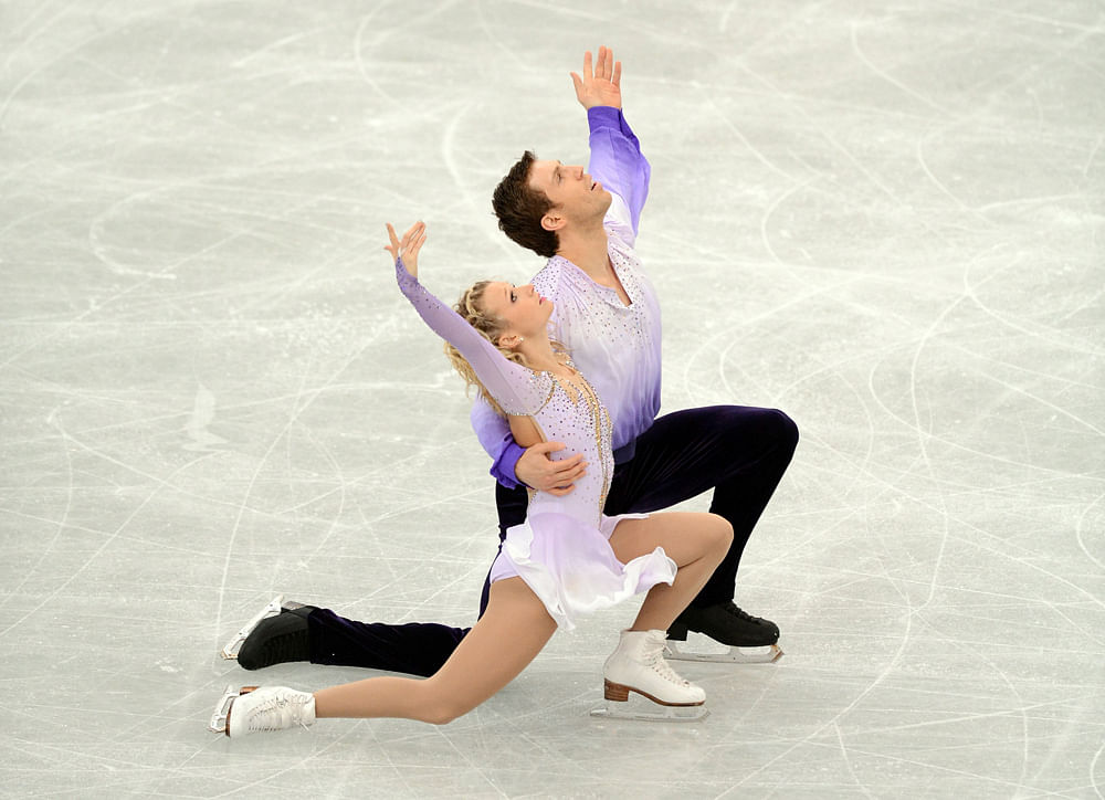 Kirsten Moore-Towers (front) and Dylan Moscovitch of Canada perform during pairs free skating event at the NHK Trophy, the last leg of the six-stage ISU figure skating Grand Prix series, in Rifu, northern Japan, on November 25, 2012. The Canadian pai...