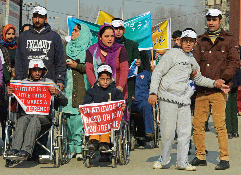 Members of the All Jammu and Kashmir Handicapped Association (AJKHA) march during an anti-government protest in Srinagar on December 3, 2010, held to mark International Day of People with Disability. The All Jammu and Kashmir Handicapped Association ...