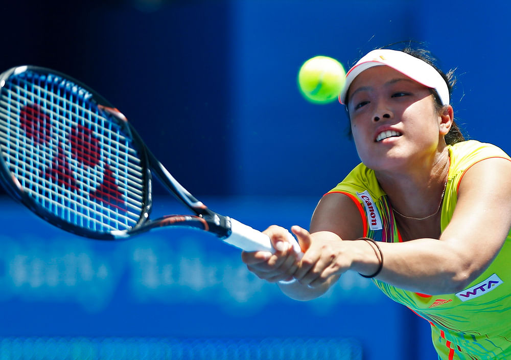 Ayumi Morita of Japan hits a return to Li Na of China during their women's singles match at the Sydney International tennis tournament in Sydney January 8, 2013. REUTERS