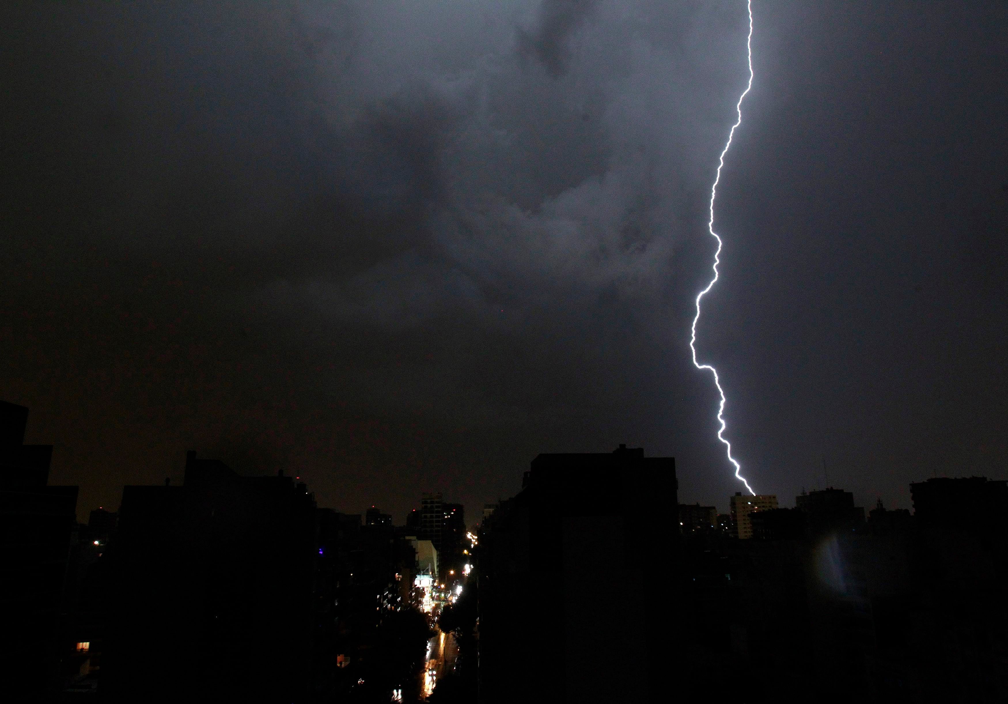 Lightning flashes over Villa Urquiza neigborhood during a thunderstorm in Buenos Aires February 1, 2013. REUTERS
