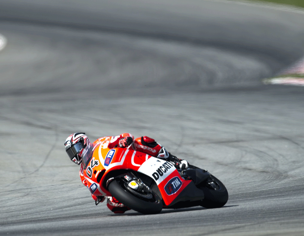 Ducati rider Andrea Dovizioso of Italy powers his bike on the third and final day of the pre-season test at the Sepang circuit in Sepang outside Kuala Lumpur on February 7, 2013.