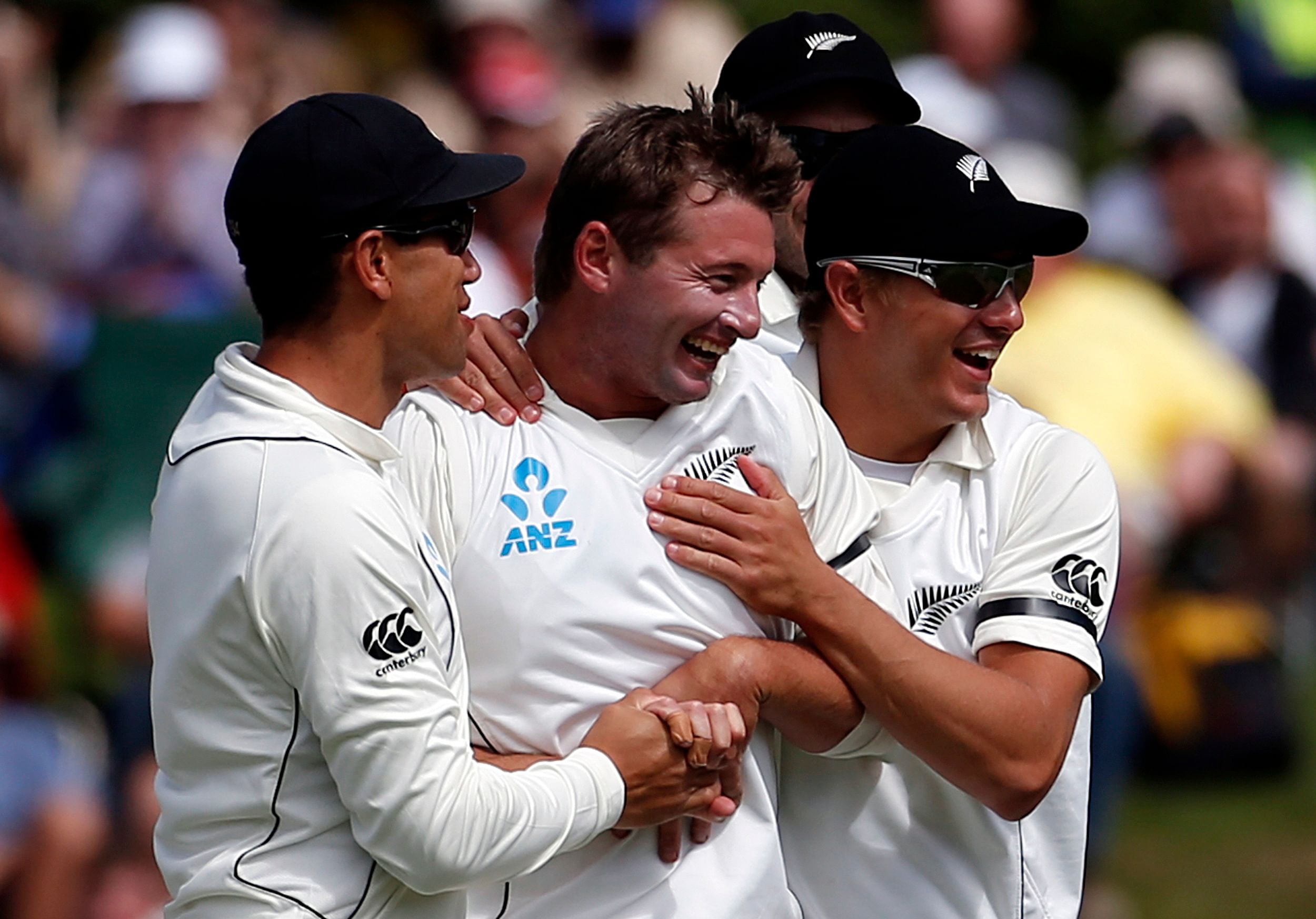 New Zealand's Martin celebrates with teammates after dismissing England's Prior during the second day of the first test in DunedinNew Zealand's Bruce Martin (2nd L) celebrates with his teammates after dismissing England's Matt Prior for 23 runs to ta...