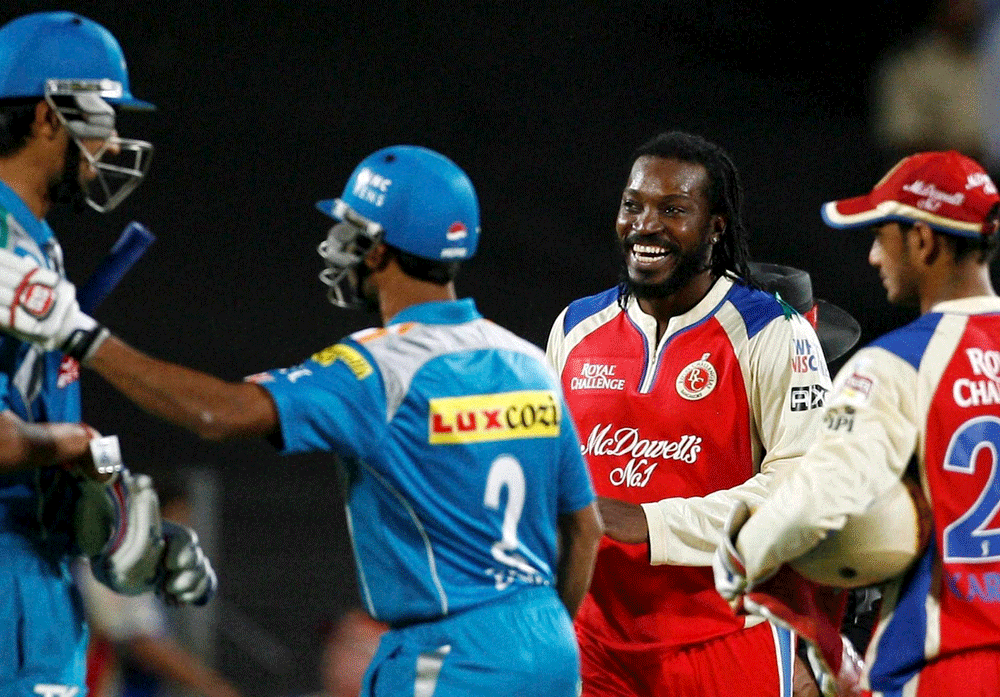 Royal Challengers Bangalore Chris Gayle celebrates the victroy during  the IPL6 match against Pune Warriors in Pune on Thursday. PTI Photo