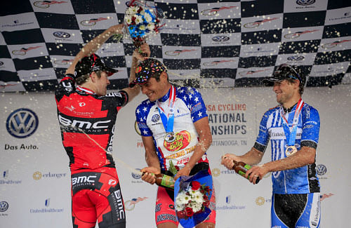 Brent Bookwalter, left, Freddy Rodriguez, center, and Kiel Reijnen,  right, spray each other with beer to celebrate their 2nd, 1st, and 3rd  place podium in downtown Chattanooga during the USA Cycling Professional  Road National Championships, Monday...