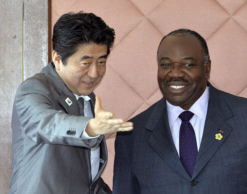 President of Gabon Ali Bongo Ondimba, right, is greeted by Japanese Prime Minister Shinzo Abe for their bilateral talks during the Tokyo International Conference on African Development (TICAD) in Yokohama, suburban Tokyo Sunday, June 2, 2013. AP Phot...
