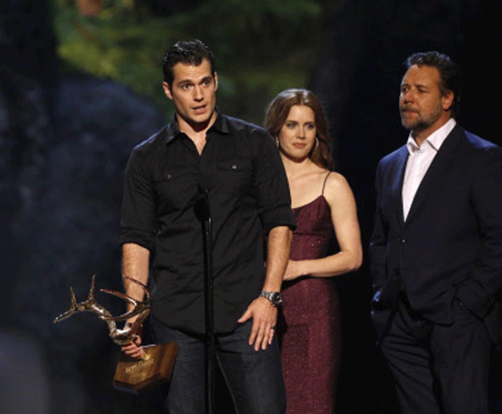 Cast member Henry Cavill speaks, accompanied by director Zack Snyder (L), co-stars Russell Crowe and Amy Adams as they accept the Most Anticipated Film award for 'Man of Steel' at the seventh annual Spike TV's 'Guys Choice' awards in Culver City, Cal...