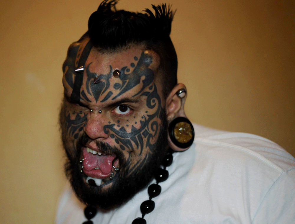 Emilio Gonzallez poses for a photograph during the annual national tattoo exhibition known as 'Inked' in Panama City June 22, 2013. REUTERS