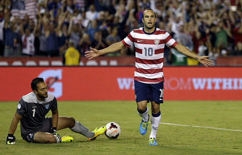 The United States' Landon Donovan, right, reacts after scoring on a penalty kick as Guatemala's goalkeeper Ricardo Jerez gets up at left in the second half during an international friendly soccer match Friday, July 5, 2013, in San Diego. AP Photo