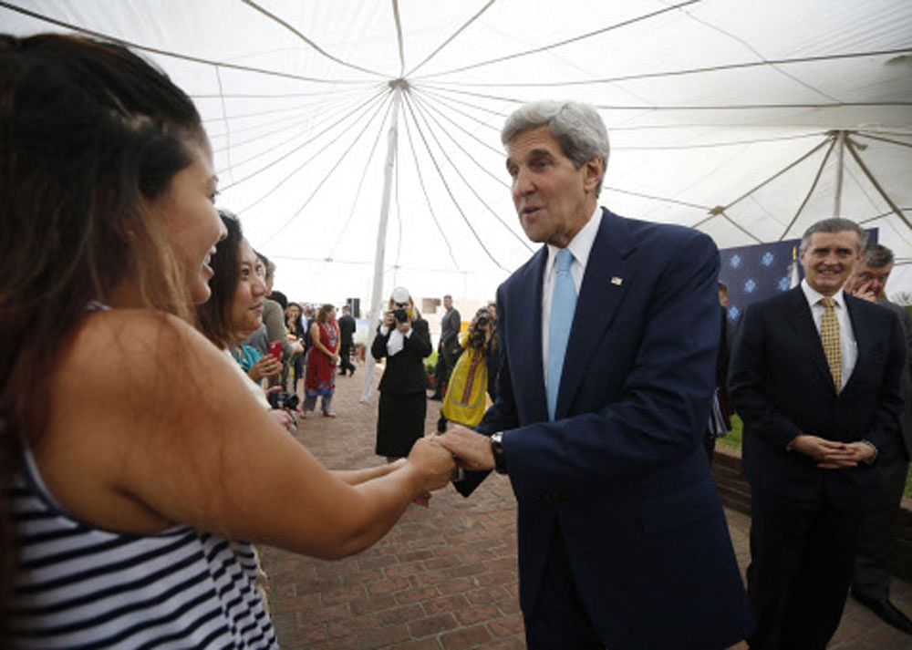 U.S. Secretary of State John Kerry meets staff at the U.S. Embassy in Islamabad August 1, 2013. Alongside Kerry is U.S. Ambassador to Pakistan Richard Olson (R). Kerry is scheduled to meet with members of Pakistan's newly elected civilian government ...