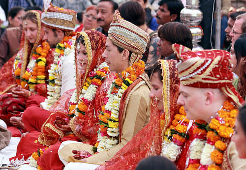  Three European couple get married in Hindu tradition in Indore on Wednesday. PTI Photo 