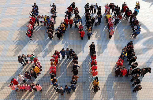 Students stand to form 'Happy 2014' to welcome the upcoming New Year at a middle school in Ma'anshan, Anhui province, December 30, 2013. REUTERS