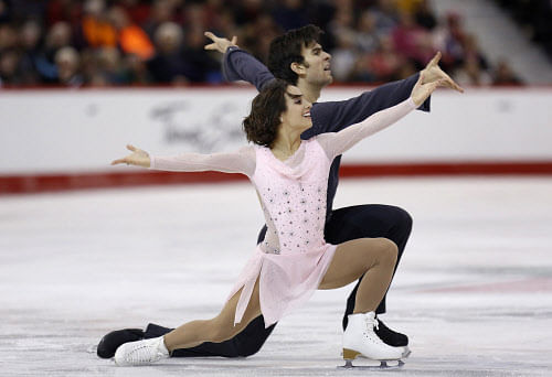 Meagan Duhamel and Eric Radford perform in the pairs short program at  the Canadian Figure Skating Championships in Ottawa January 10, 2014.  REUTERS
