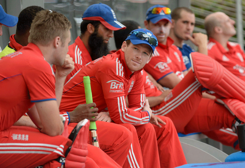 England's Eoin Morgan looks on during a rain break in their second T20 international cricket match against the West Indies' at Kensington Oval in Bridgetown, Barbados, March 11, 2014. REUTERS