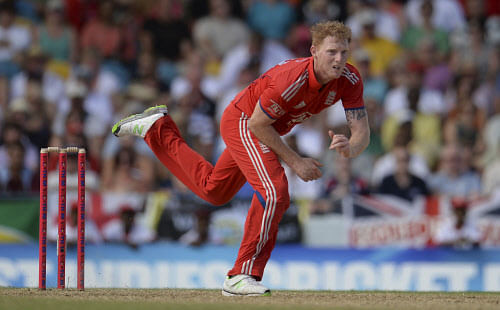 England's Ben Stokes bowls during the first T20 international against the West Indies' at Kensington Oval in Bridgetown, Barbados March 9, 2014. Stokes has been ruled out of this month's World Twenty20 in Bangladesh with a fractured hand, the England...
