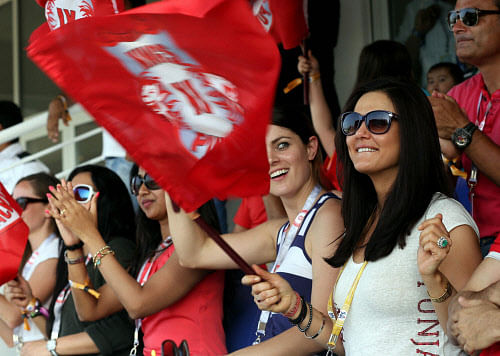 Preity Zinta owner of Kings XI Punjab watches an IPL 7 match of her team against Chennai Superkings in Abu Dhabi, United Arab Emirates on Friday. PTI Photo