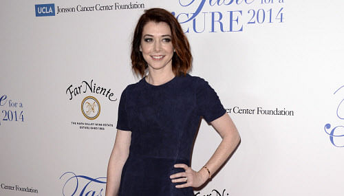 Alyson Hannigan arrives at the 19th annual 'Taste For A Cure' at the Beverly Wilshire Hotel, Friday, April 25, 2014, in Beverly Hills, Calif. AP Photo