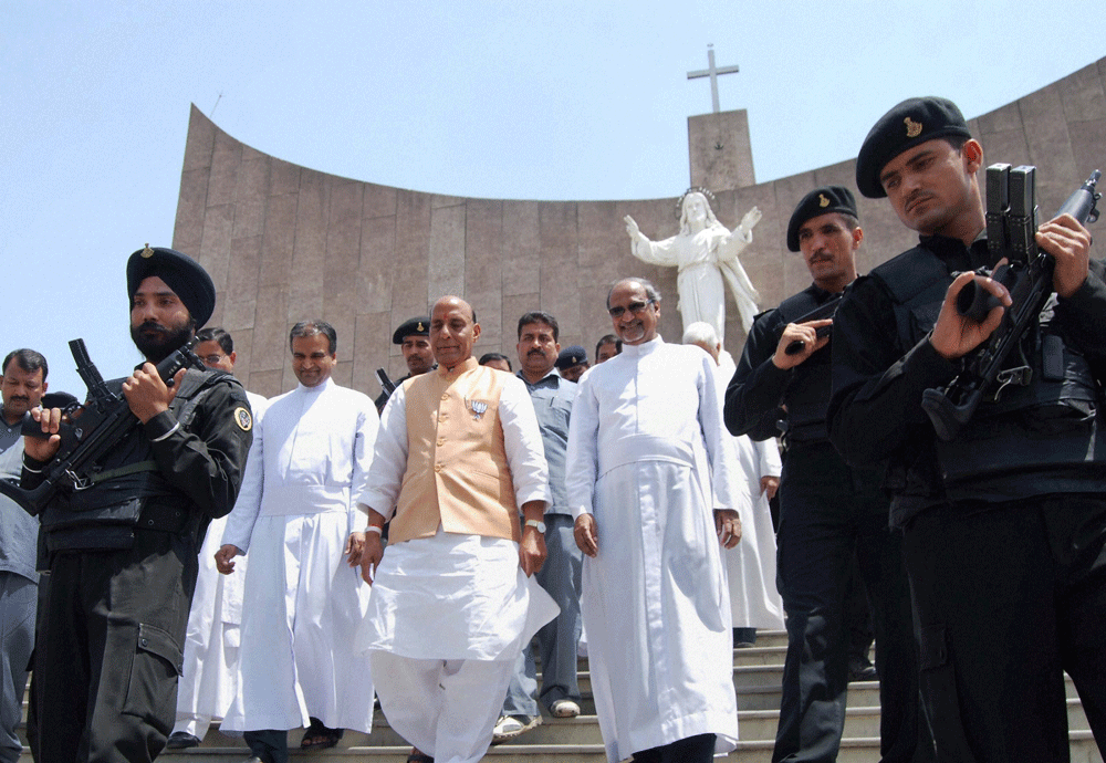 Lucknow: BJP President Rajnath Singh with Christian priests during a visit to the Cathedra Church in Lucknow on Saturday. PTI Photo by Nand Kumar