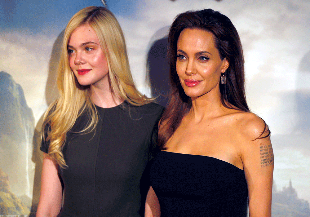 Actresses Angelina Jolie and Elle Fanning pose during a photocall for the film 'Maleficent' (Malefique) in Paris. Reuters photo