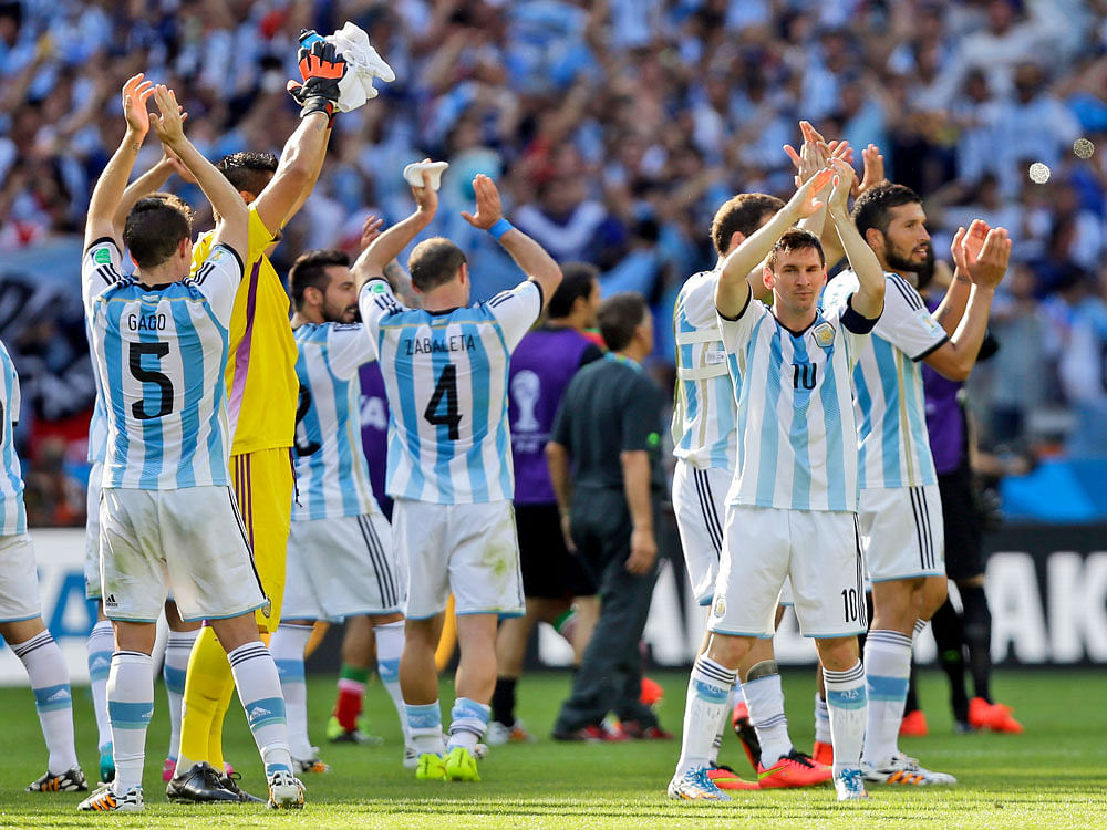 Argentina's Lionel Messi and his teammates applaud after their 1-0 victory over Iran during the group F World Cup soccer match between Argentina and Iran at the Mineirao Stadium in Belo Horizonte, Brazil, Saturday, June 21, 2014. AP Photo