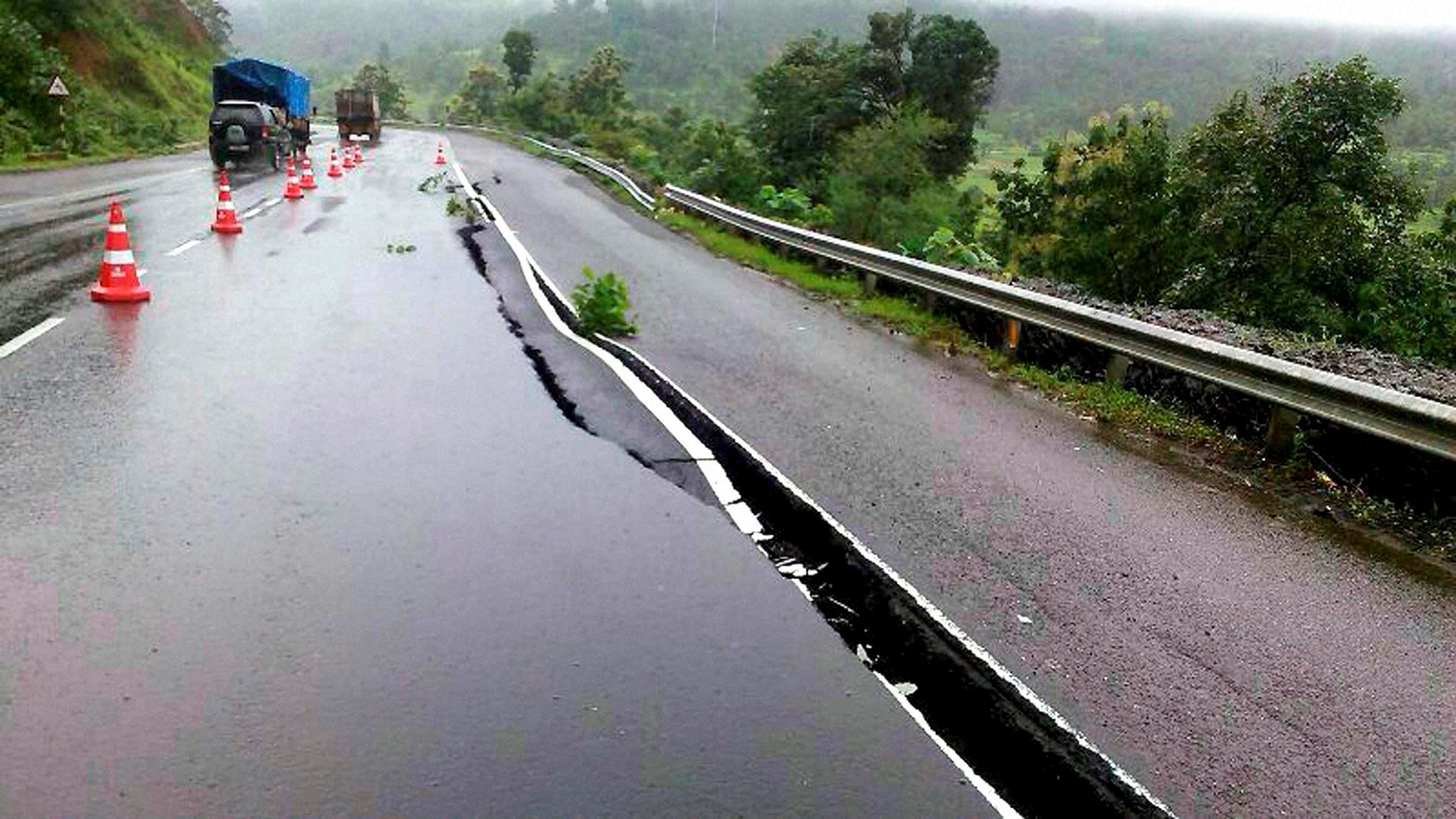 Igatpuri : A crack seen on the highway caused by the erosion due to heavy rains at Kasara Ghat near Igatpuri, Maharashtra on Thursday. PTI Photo