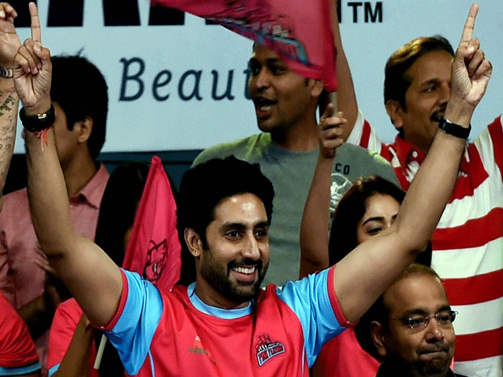 Bollywood actor and Jaipur Pink Panthers owner Abhisekh Bachchan celebrates his team's win against Patna Pirates during Pro Kabadi league match in Kolkata on Saturday late evening. PTI Photo